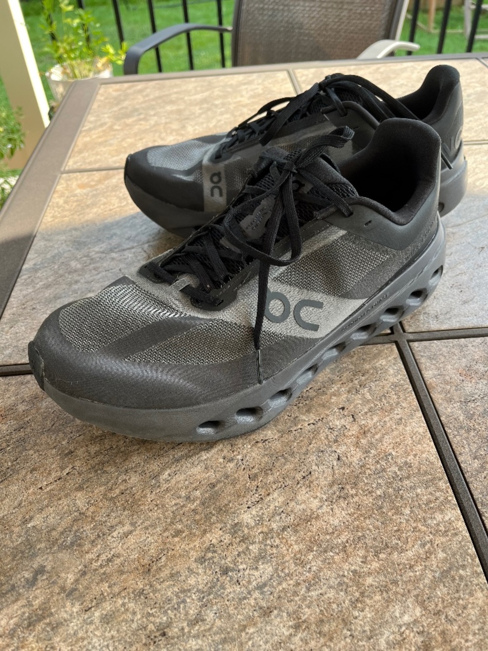 On cloudsurfer next black eclipse sneakers